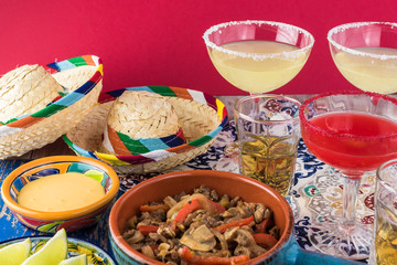Mexican fiesta table with food and drinks.