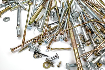 pile of Screws and washers on white background