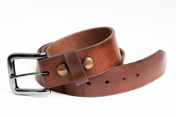 A formal studio product shot of a men’s used brown leather belt with patina set on plain white background.