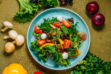 fresh vegetable salad, healthy food on a decorated table