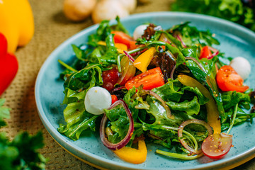 fresh vegetable salad, healthy food on a decorated table