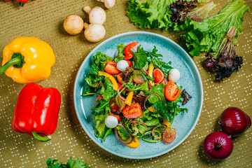 fresh vegetable salad, healthy food on a decorated table