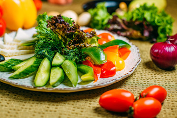 assorted vegetables and cheese, healthy food on a decorated table