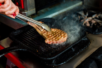 grilled steak, cooking process in the kitchen