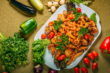 Assorted chicken, a dish for the company, on a decorated table