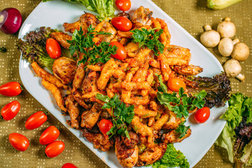 Assorted chicken, a dish for the company, on a decorated table