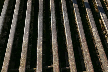 Grill of old rusty rails on a farm