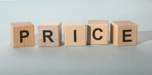inscription price on wooden cubes on white blue background