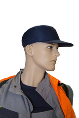 A mannequin of a worker dressed in a blue cap and overalls of gray orange color isolated on a white background, labor protection, protective equipment.