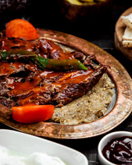 turkish lamb kebab place on smashed aubergine