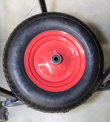 Inflatable wheel for a garden wheelbarrow with a red metal disk, inventory, garden equipment, agriculture.