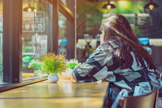 Artificial plants or plastic tree on table for decoration and welcome for customers in coffee shop.