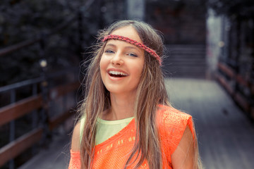 Free happy woman enjoying nature. beautiful young hipster woman smiling