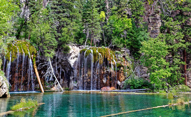 Wispy waterfalls flow into Colorado's Hanging Lake, a popular hiking destination near Glenwood Springs
