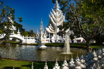 Fototapeta premium A beautiful view of white temple at Chiang Rai, Thailand.