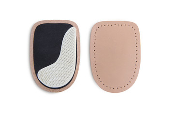 Orthopedic silicone heel pad from corns for the correction of different lengths of legs isolated on white background. Silicone insert for the forefoot. Insole. Silicone thumb protector with interdigit