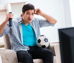 Man watching tv at home