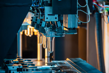 The tube preform shape of bottles preheat process on the production line to the automatic blowing...