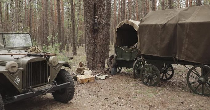 Set. Russian Soviet World War II Four-wheel Drive Army Truck Gaz-67 Car And Peasant Carts In Forest. WWII Equipment Of Red Army