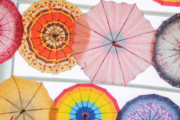 multi-colored umbrellas over the head