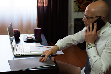 Man teleworking at home. Confinement due to coronavirus