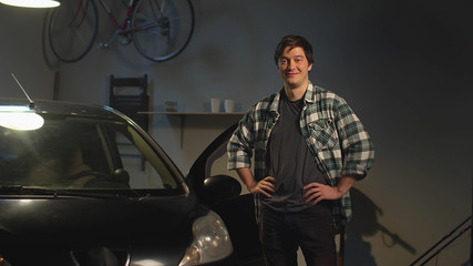 Auto mechanic in his workshop. Work on camera
