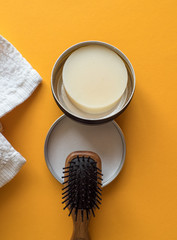 Solid, plastic free Shampoo bar in a round metal container