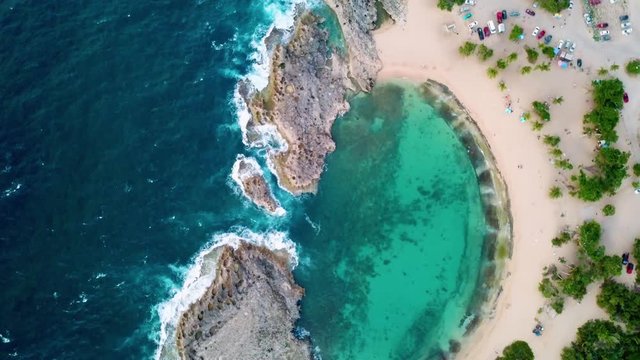 Aerial, rising, drone shot top down above the Manati beach, sunny day, in Puerto Rico, USA
