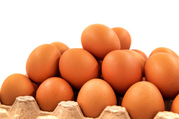 Chicken eggs on a white background in an organic box