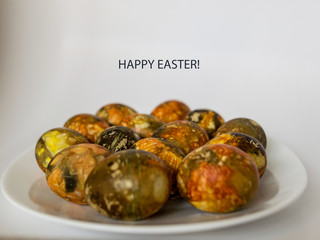 many bright and colorful Easter eggs and the inscription 