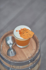 alcoholic cocktail with fruits on an old wooden table