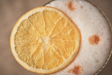 close-up alcoholic cocktail with fruit on an old wooden table