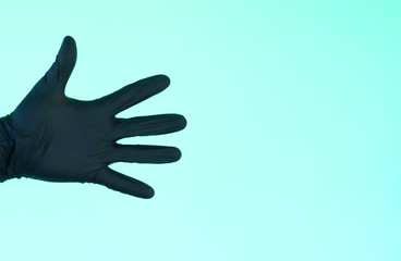 Obraz premium hand in sterile black gloves