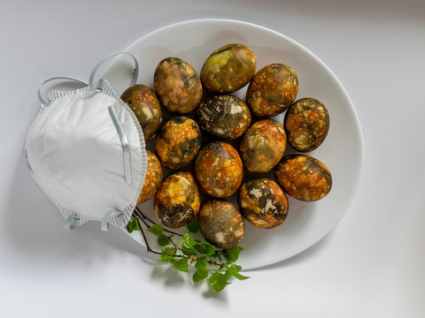 many bright and colorful Easter eggs and face mask