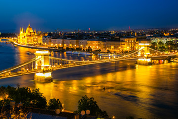 Panoramic of Chain Bridge and Parliament in Budapest at dusk