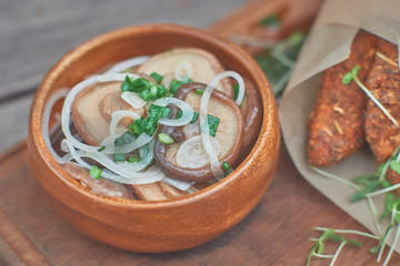 mushrooms and white sauce on an old wooden table