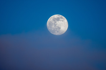 Full moon photographed on an early spring evening.