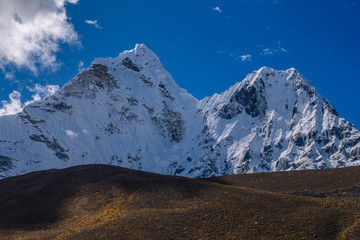 Beautiful mountain peaks and soft white clouds