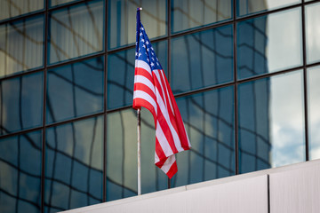 American flag on the background of the building