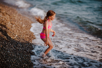 girl jumping on the waves