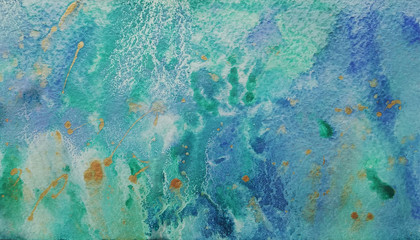 Watercolor abstract background green color with splashes of blue and gold, paint stains on watercolor paper, texture of paper