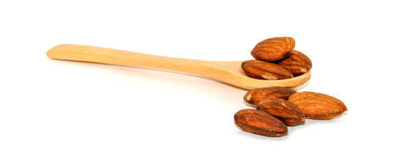 pile of almonds seeds isolated on white background