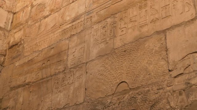 There Are Drawings of Pharaohs, Gods, Priests and Different Hieroglyphs on the Wall of the Temple. Historical Drawings on a Stone Wall of the Old Building in Luxor were Made Many Yeas Ago B.C.