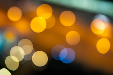 Bokeh lights, city streets at night, orange and yellow, used as a background Shot with lens blur