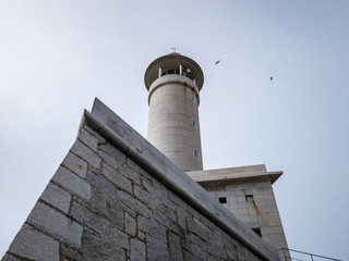 Looking up to Lighthouse of Punta Nariga, Death Coast, Galicia, Spain