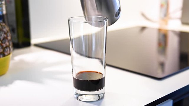 Hot, steamed milk being poured in glass with coffee, stock footage by Brian Holm Nielsen