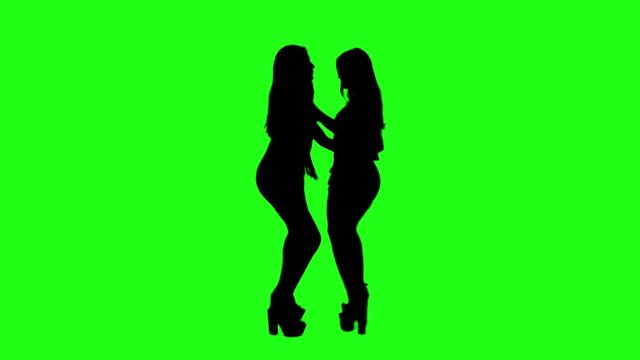 A sexy couple woman girl dancing silhouette on a green screen chroma key background 4K 60Fps pre-keyed footage charming female dancing group of friends celebrating new years eve party having fun tocuh