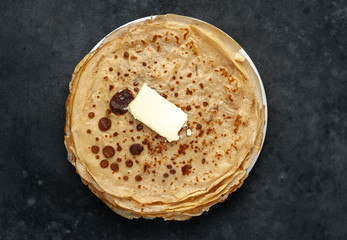 thin pancakes on a stone background