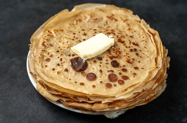 thin pancakes on a stone background