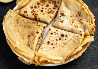 thin pancakes on a stone background
